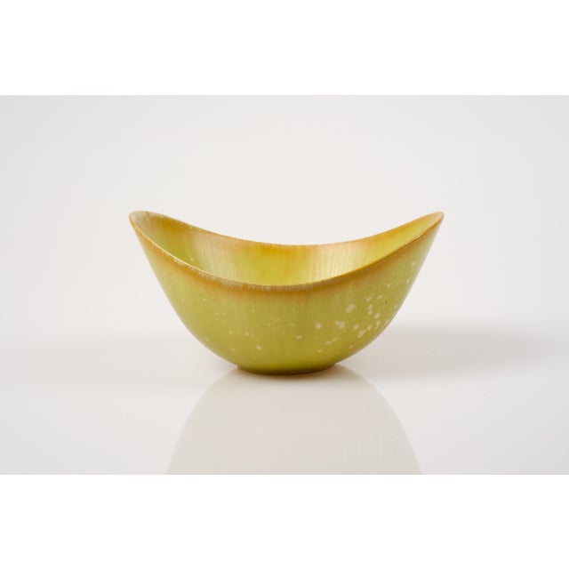 Iconic stoneware bowl by Gunnar Nylund for Rörstrand. Modern and timeless design. This piece is coated with a multi-...