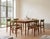 Elegant set of six Danish teak dining chairs attributed to Erik Buch and produced in the 1960s. Featuring a light and...