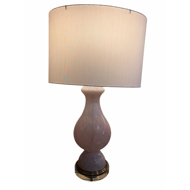 This exquisite pair of mid-century modern table lamps, beautifully attributed to the master glassmakers of Murano, Italy,...
