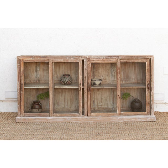This 70-inch long sideboard is a rare and functional masterpiece of architectural salvage, redesigned for the modern,...