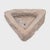 This small stone basin was carved by hand nearly two centuries ago, sculpted from solid limestone to an unusual triangular...