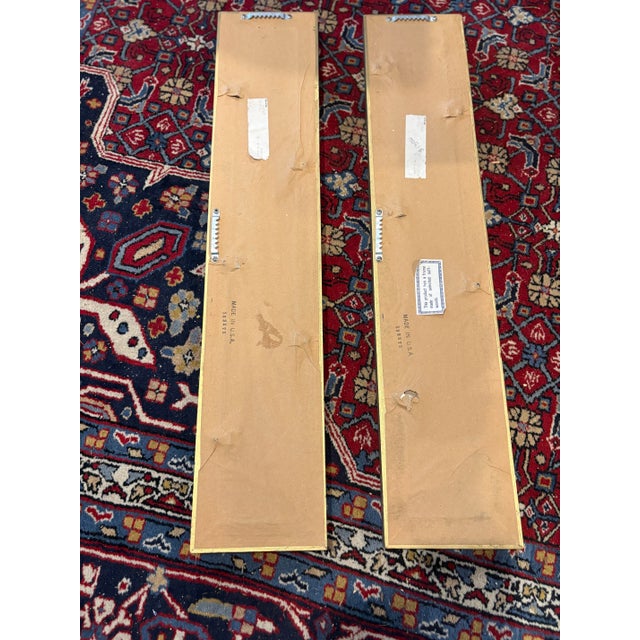 Striking pair of vintage mid-century Hollywood Regency accent wall mirrors. These mirrors are well made with their 3 step...