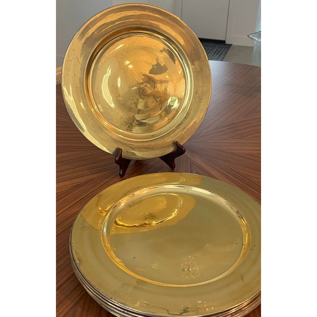 This mid-century set of 12 brass pantry chargers will make a gorgeous base for any layered table setting from mid-century...