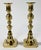 Pair of antique 19th C English brass candlesticks featuring elegant inverted beehive form. Each holds a single taper....