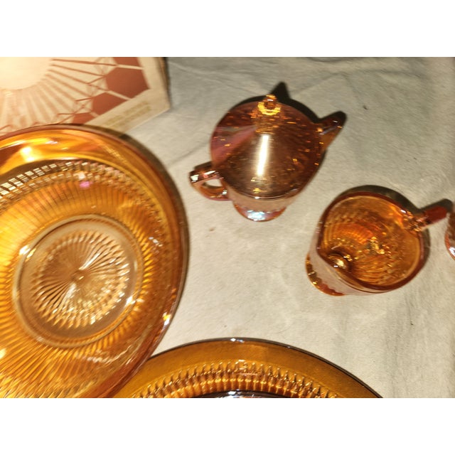 Complete with original box, 35 piece set of Jeannette Glass Marigold Anniversary pattern dinner ware to include a lidded...