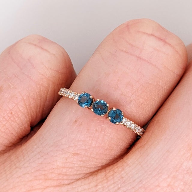 This sleek 3 stone emerald fashion ring with natural diamonds is subtle and classy. It's sturdy band allows for every day,...