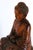 Elevate your space with this substantial 16" seated Buddha statue, entirely hand carved fro solid Asian hardwood....