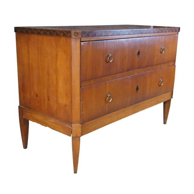 Antique German Biedermeier dresser / chest of drawers / console. Made of cherry featuring rectangular form with wavecrest...