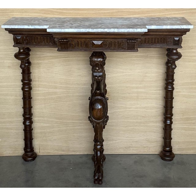 Antique French Renaissance Revival Carved Ornate Figural Bust, Lions Bust Walnut Console Table The sides of this...