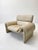 The ivory-colored ds-2011/01 armchair by de sede is an elegant and comfortable piece of furniture distinguished by...