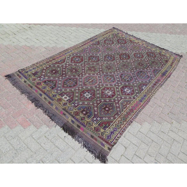 This beautiful, traditional vintage, flat weaved Turkish kilim rug is approximately 60 years old. It is handmade of very...