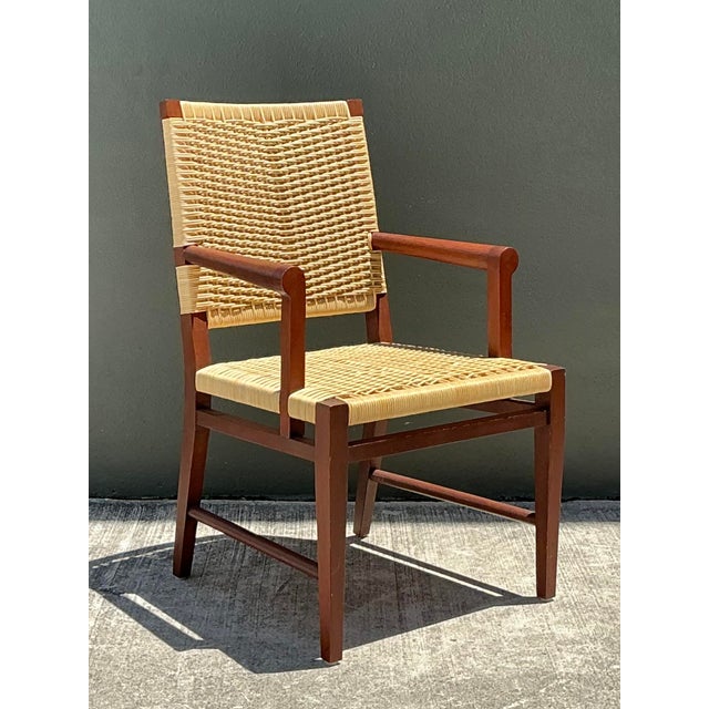 This iconic armchair from the celebrated Donghia "Merbau" collection exemplifies the brand’s commitment to understated...