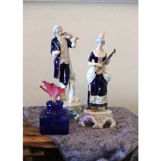 This is a beautiful pair of Royal Dux colonial figurines of a man and a woman playing instruments. Founded in 1860, these...