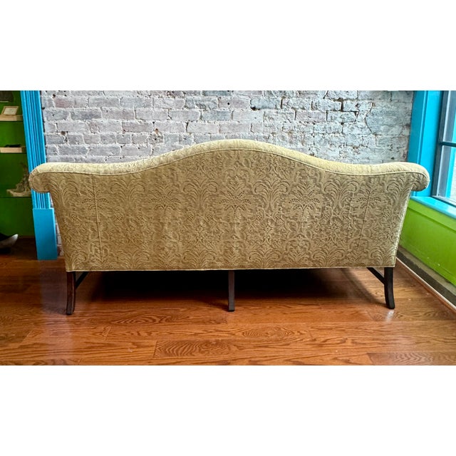 A truly statement piece — this Vintage Chippendale Camel Back Sofa is upholstered in a rich velvet damask fabric that...