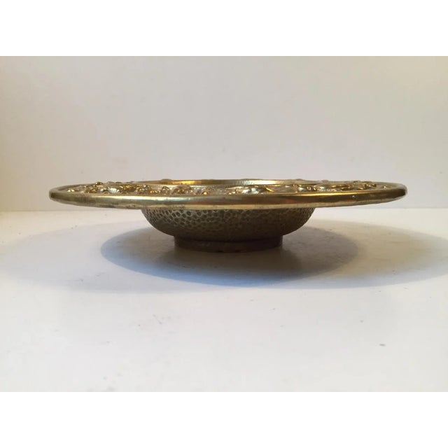 This decorative and heavy bronze bowl with Zodiac sign motifs resembles the surface of the moon. It was manufactured and...
