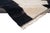 Light and shadow, cut into bold abstract form. This hand-knotted Moroccan wool rug plays with dramatic contrast — two...
