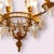 Original 19th-century chandelier. Its gilt bronze structure, decorated in a Neoclassical style, holds four lights. At the...