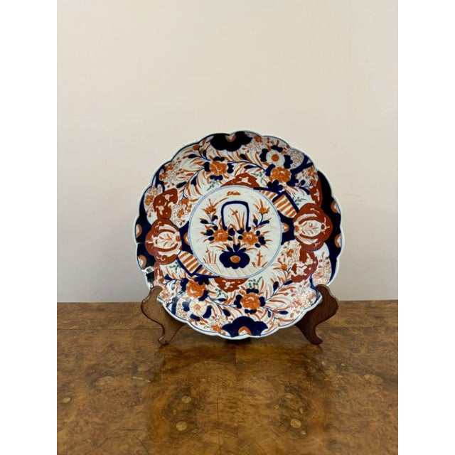 Large antique Japanese imari plate, having a quality antique imari plate with a scalloped shape edge, decorated with a...