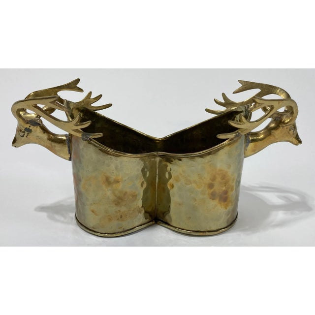 Whimsical two bottle wine caddy in hammered brass featuring prominent stag deer handles at either side. Lovely patina.