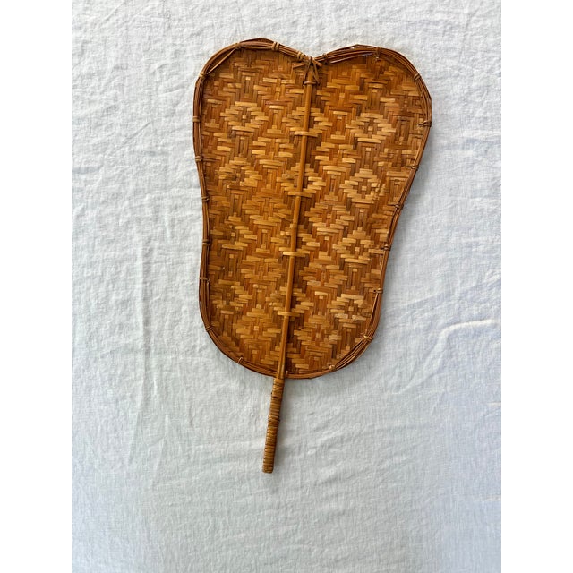 The handwoven bamboo fan is a traditional item from Chinese and other Asian cultures. The breeze fan or Pankha features a...