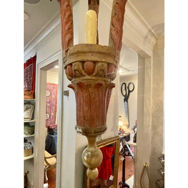 A French, Neoclassical style bleached color carved wood and painted lantern with three supports, the supports topped with...