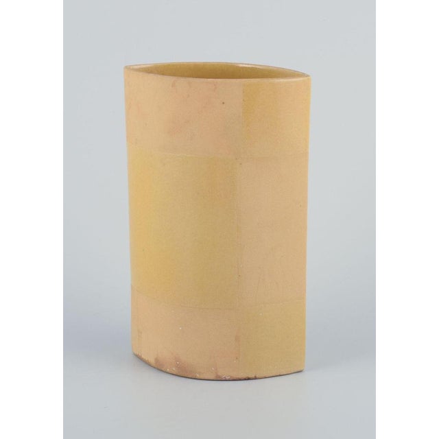 European studio ceramicist. Unique ceramic vase. Yellow glaze. Glazed and unglazed. Circa 1980s. Indistinct artist...