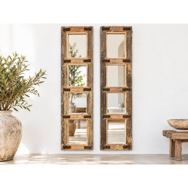 With a history whispering from Rajasthan, India, this unique pair of four-panel farmhouse style mirrors boasts a rustic...