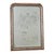 A French 19th century Louis Philippe mirror in an arched, silver gilt frame enhanced by dark oxidation and craquelure...