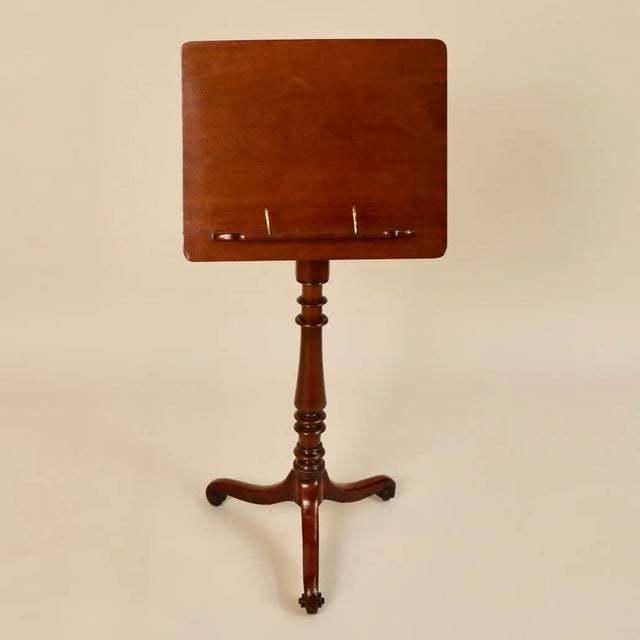 Circa 1820 English Mahogany Reading Stand you will fall in love with! It has metal pins to hold your favorite readings...