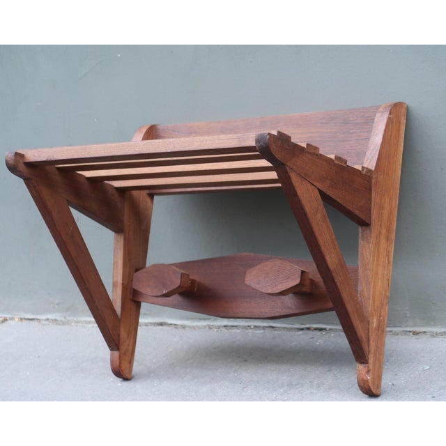 1950s wall-mounted teak coat hanger It offers two coat hooks and a shelf. Very Good condition with minor traces of use in...