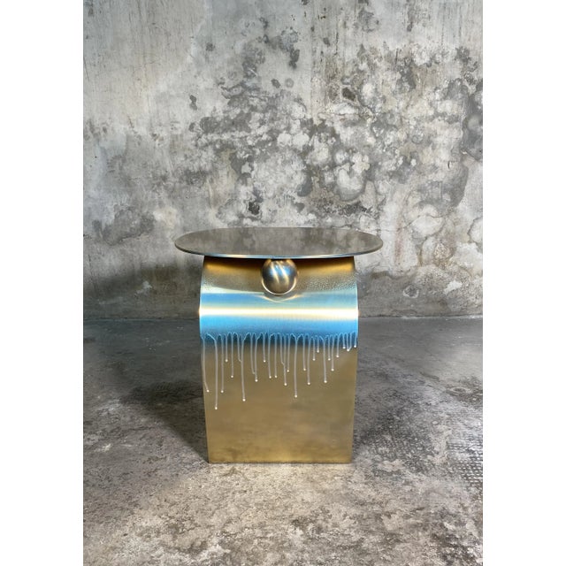 "Golden fish" sculpture table (38x28 H40) is a unique piece made entirely of painted brass with pearl-effect carving and...