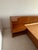 Mid-century modern teak integrated king size platform bedframe & headboard with rounded corners; storage drawers on left &...