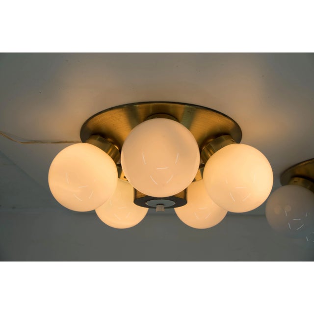 Flushmount type 77 315, made by elektroinstala decin in former czechoslovakia in 1970s. Made of brass and opaline glass....