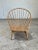Danish modern blonde spindle back chair in the style of Hans Wegner peacock chair. Newly refinished, in excellent vintage...