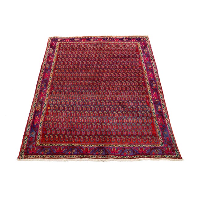 Vintage Persian Shiraz Hand-knotted wool rug with red background and multicolor accents in an allover Boteh design. This...
