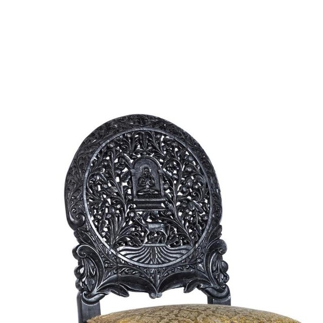 Furniture - Pair of Indian chairs. Indian; 20th century, made of exotic carved wood with profuse vegetal decoration;...
