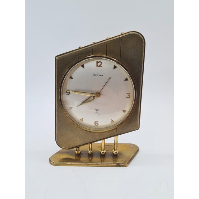 An original mechanical table clock by Europa, crafted from brass and designed in the distinctive style of German Modernism...