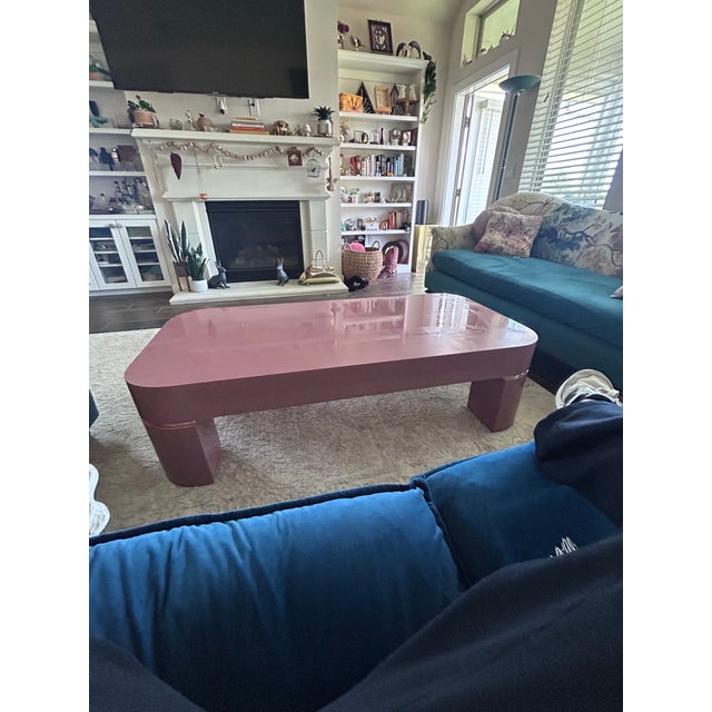 Striking vintage postmodern coffee table featuring a sculptural waterfall silhouette in a glossy mauve lacquer finish with...