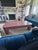 Striking vintage postmodern coffee table featuring a sculptural waterfall silhouette in a glossy mauve lacquer finish with...