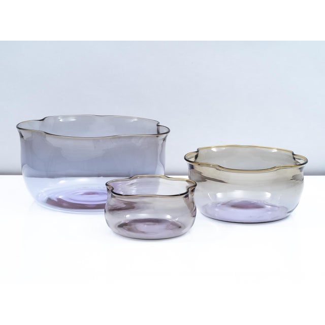 Stunning set of three blown glass nesting vases designed by Sergio Asti for Salviati in 2003. Each vase has a light purple...