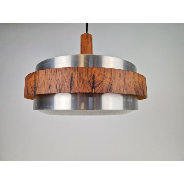 Vintage Hanging lamp teak alu Scandinavian design ‘60 Vintage hanging lamp Space with teak wood details. This hanging lamp...