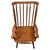 A beautifully crafted 20th-century stick back armchair, constructed in pitch pine and combining traditional country...