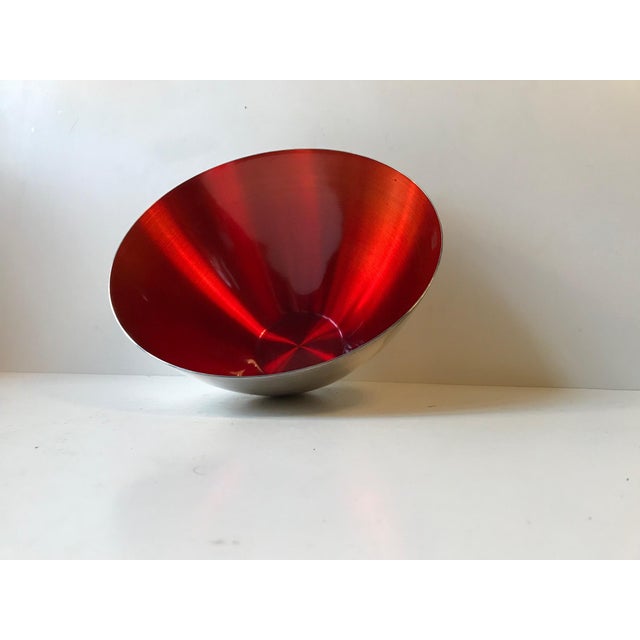 This large conical Silver Plate bowl's interior is decorated with a deep ruby red enamel. The piece was manufactured and...