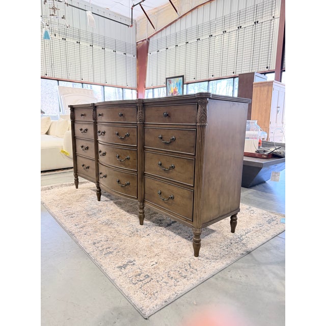 A distinguished dresser that reflects classic European influence through its graceful bowfront silhouette and refined...