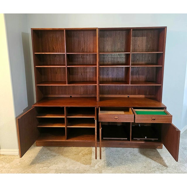 A stunning teak wall double unit designed by Erik Brouer for Brouer Mobelfabrik in Denmark. Rich, warm colored wood with...