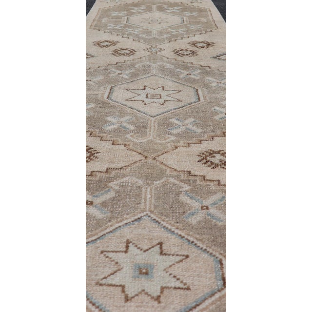 Shabby Chic Vintage Turkish Oushak Runner With Soft Earth Tones and Geometric Star Motifs For Sale - Image 3 of 10