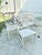 Fabulous vintage patio set. Features a dining table with glass top and six dining chairs (two arms and four sides). Faux...