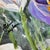 Original floral still life by contemporary artist Robin Blakely Vaughan, featuring delicate spring blooms in soft purples,...