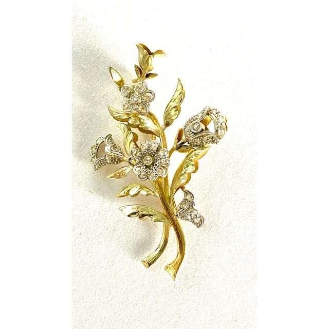 Elevate your jewelry collection with this exquisite Mid-Century Vintage Platinum and 18k Yellow Gold Diamond Brooch, a...
