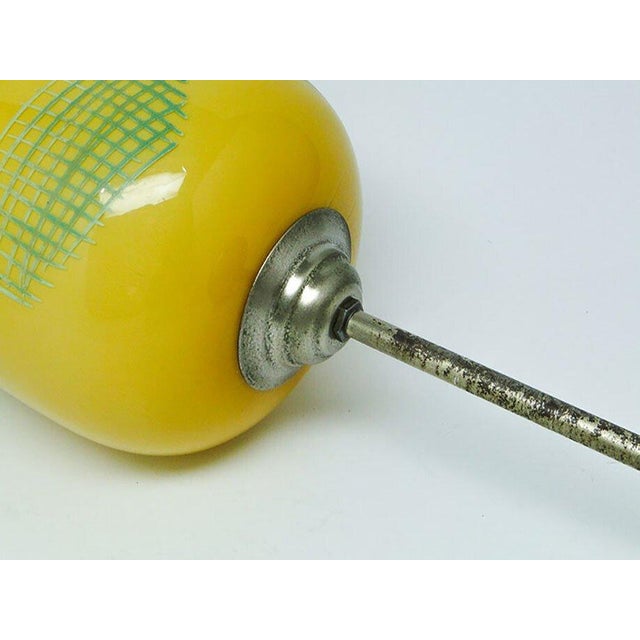The pendant lamp was produced in the 50s. The construction is brass, glass lampshade. It is preserved in very good...
